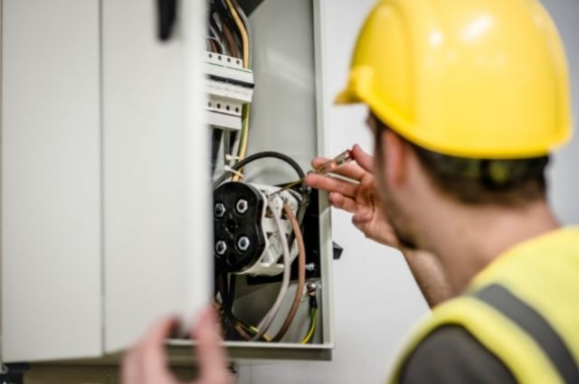 electrician working on electrical panel upgrade