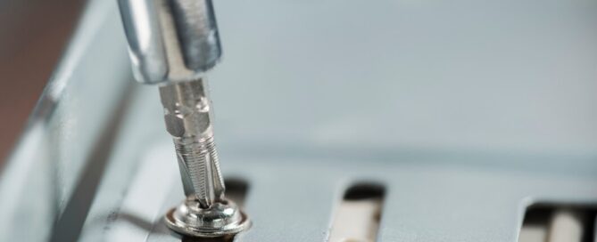 Close-up of Prescott Valley electrician tightening a screw inside a home electrical panel