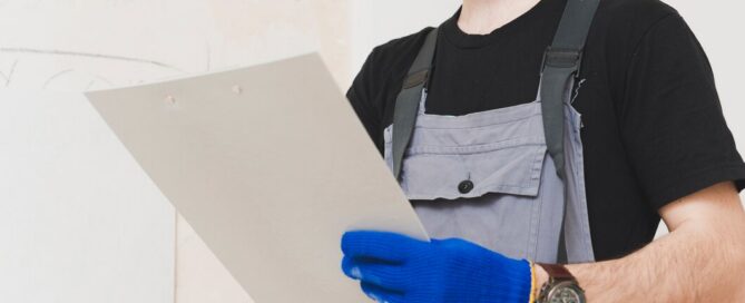 Prescott Valley electrician reviewing a price guide and estimate sheet for electrical work
