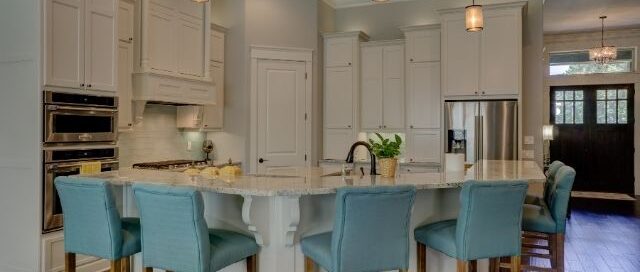 Modern kitchen with island seating and track-style pendant lighting installed by a Prescott Valley electrician