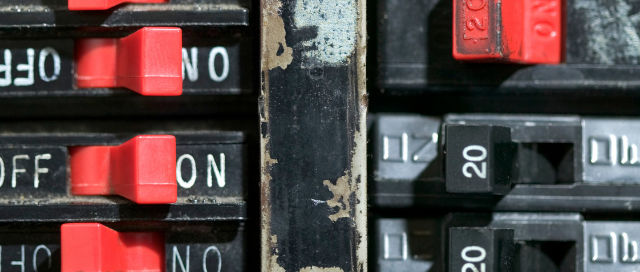 Close-up of circuit breaker switches in an electrical panel as a Prescott Valley electrician from Assurance Electrical troubleshoots a tripping breaker