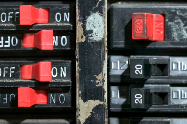 Close-up of circuit breaker switches in an electrical panel as a Prescott Valley electrician from Assurance Electrical troubleshoots a tripping breaker