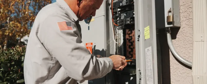 Licensed Prescott AZ electrician showing credentials and license to homeowner before starting electrical work