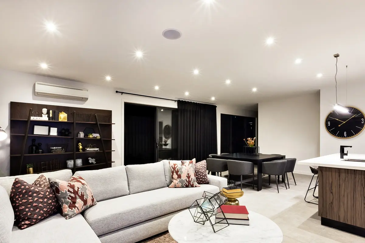 recessed lighting without major drywall repairs shown in a modern living room with evenly spaced ceiling lights.